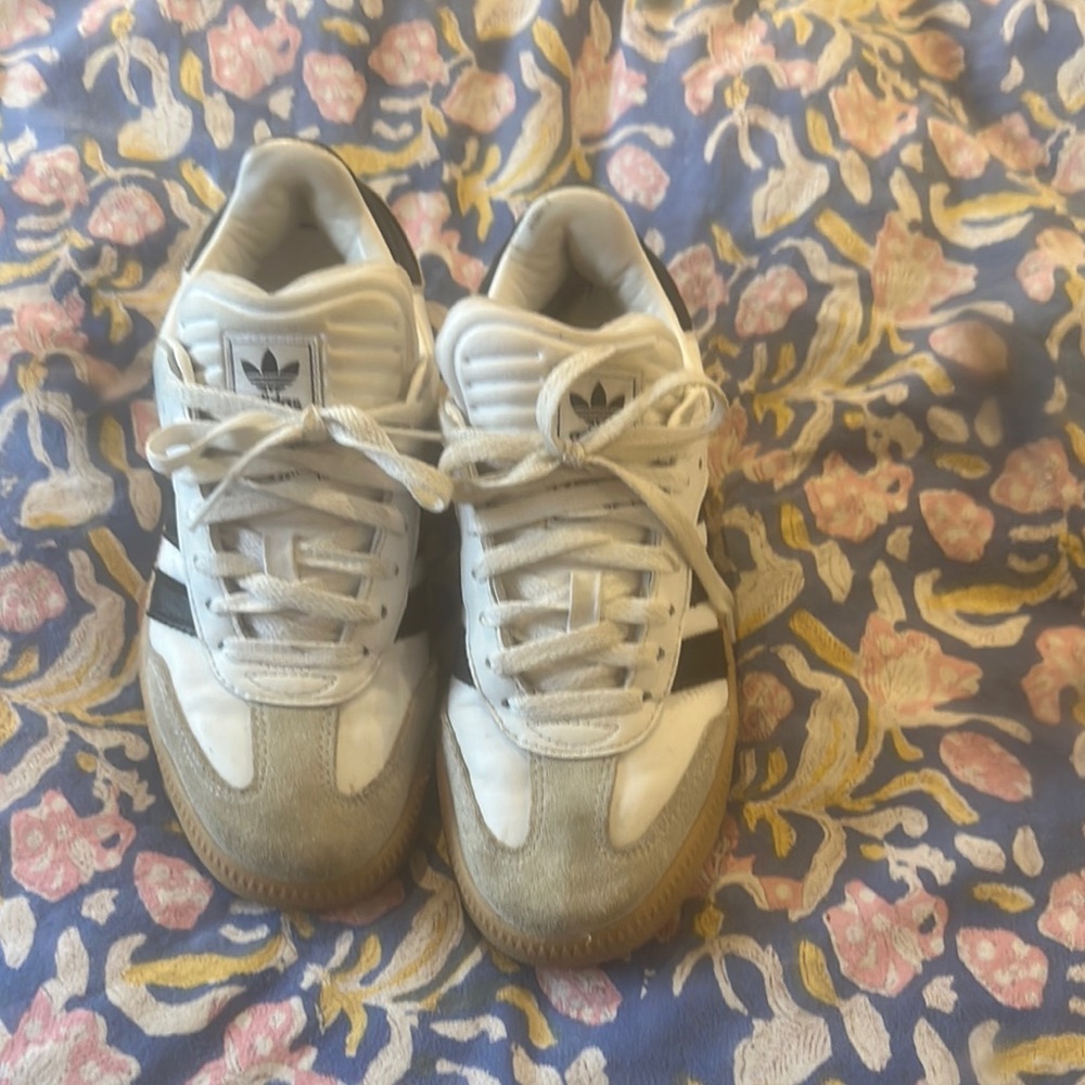 Adidas black and white sambas.  Men’s size 6, women’s size 8.